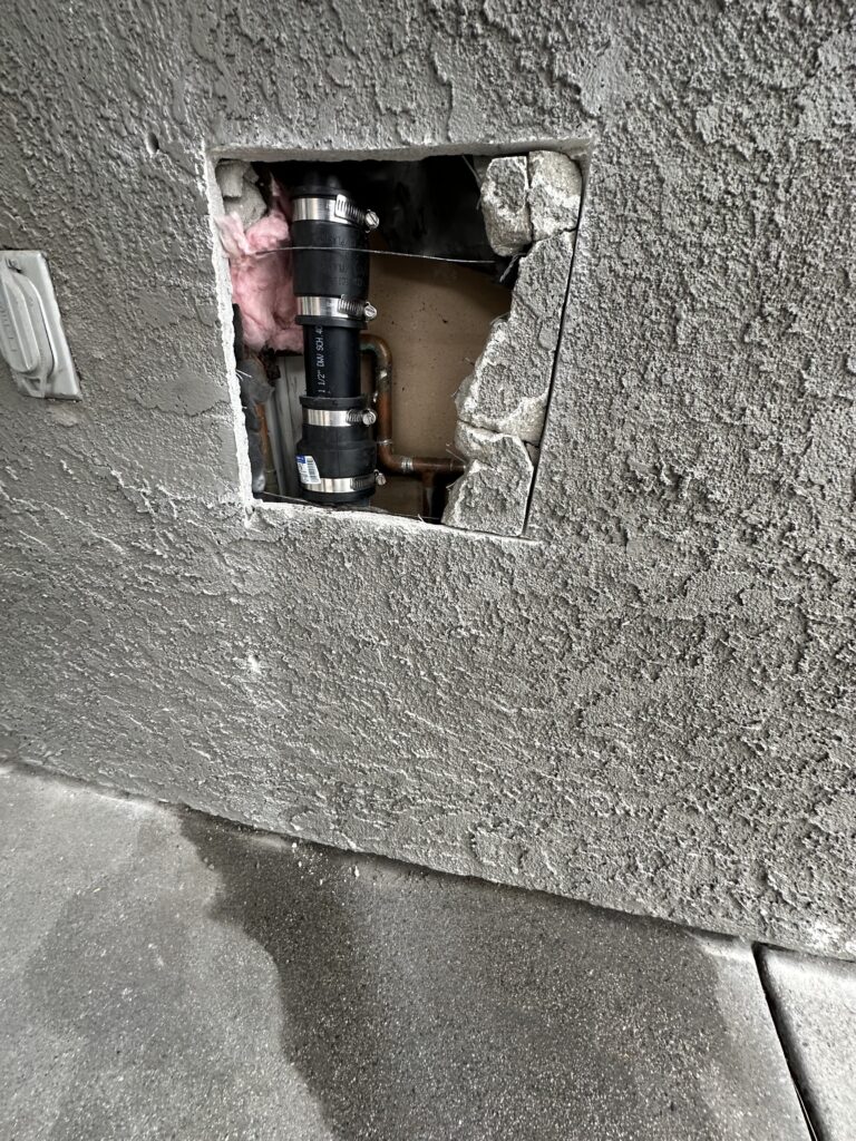 Drain Pipe Leak Repair Drain leak repair being performed to fix damaged or leaking drain pipes.