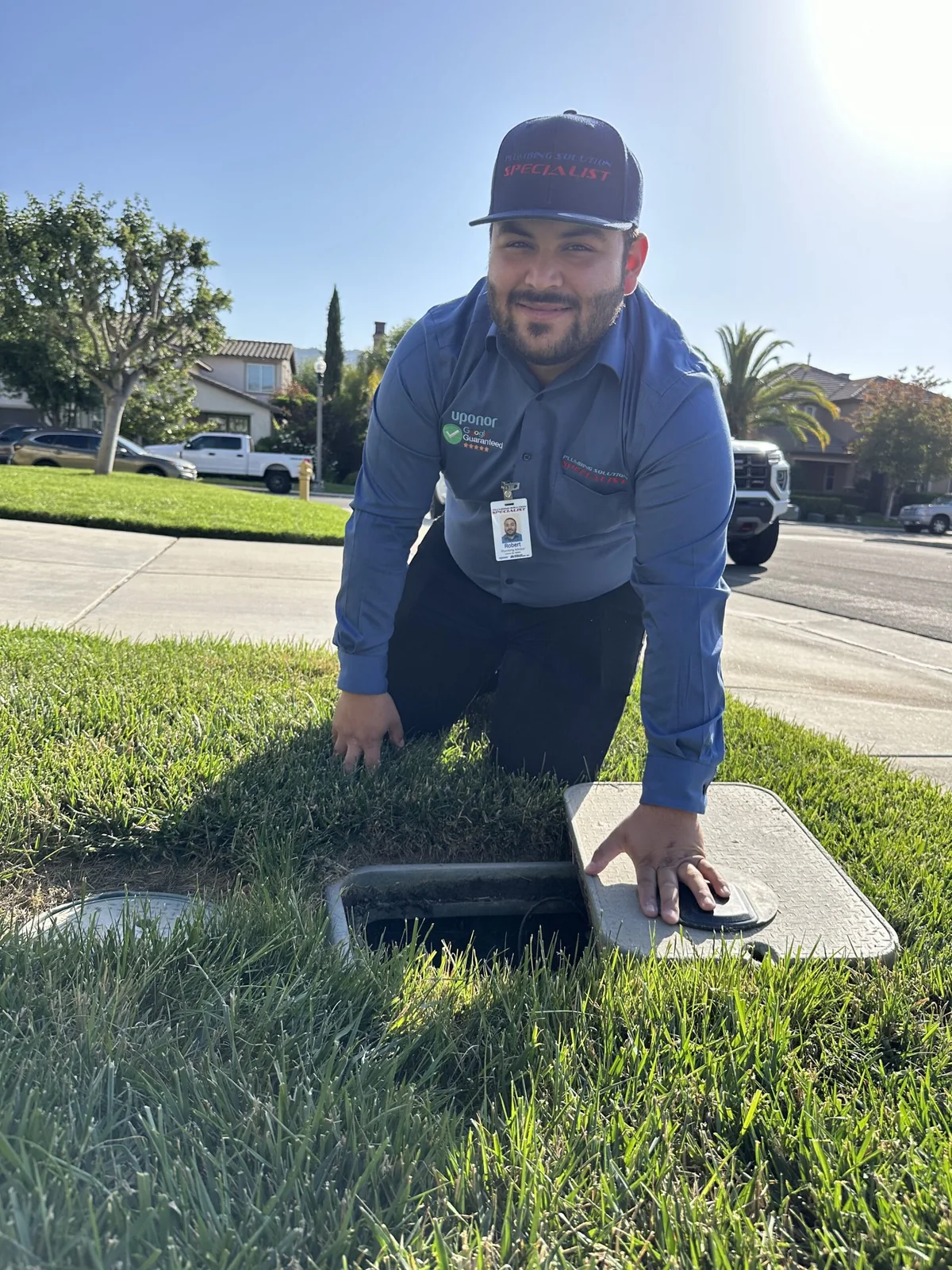 Technician checking an exterior water meter during a controlled leak test