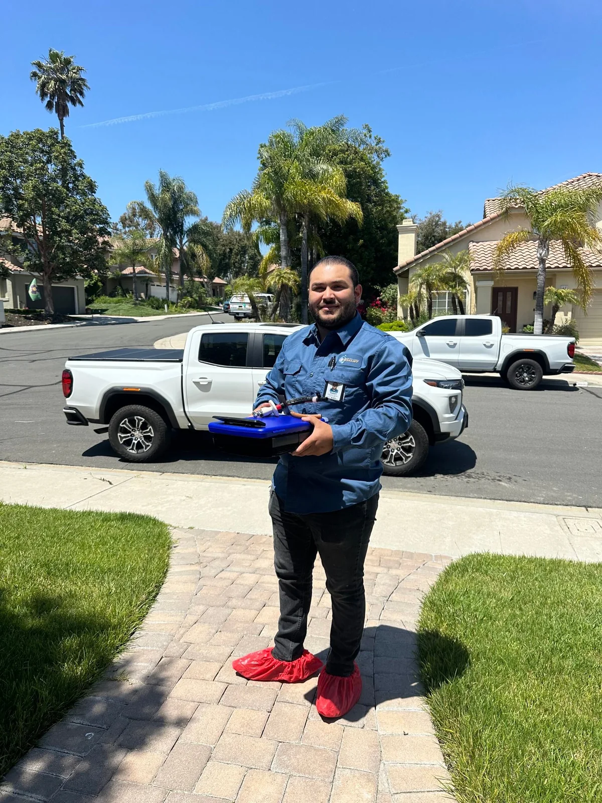 Plumbing Solution Specialist technician prepared for an outdoor water line inspection