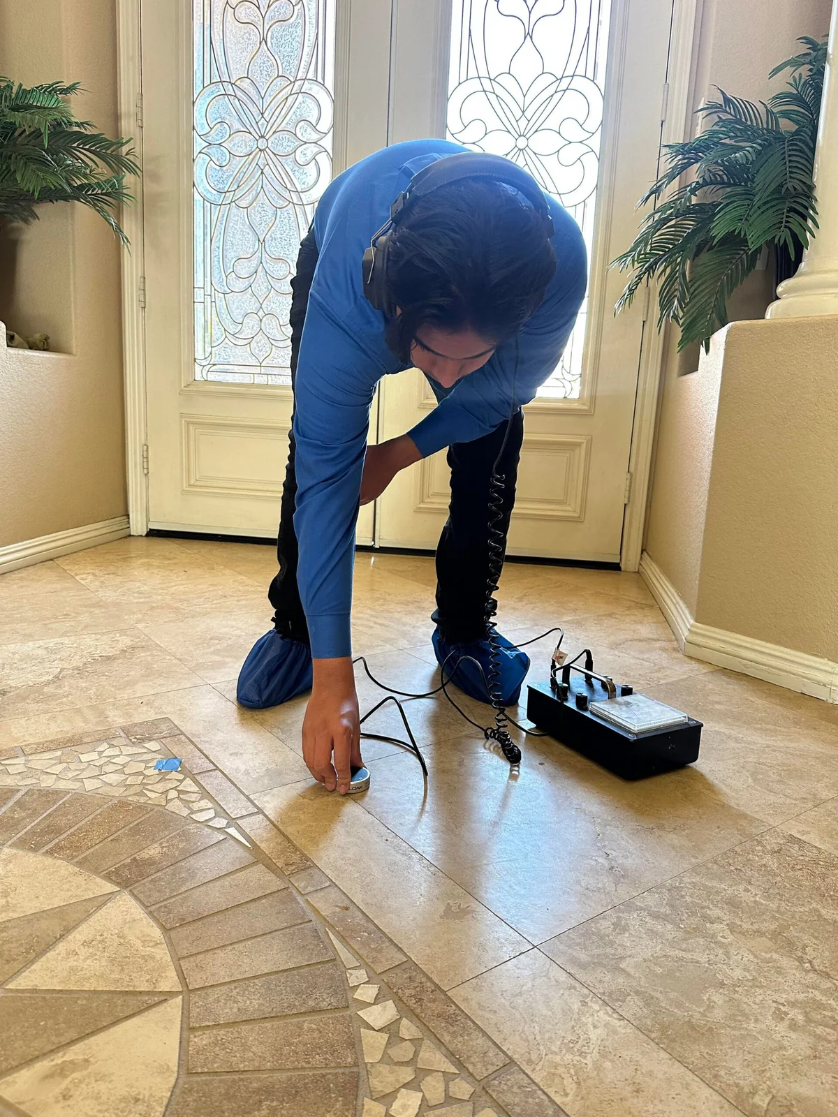 Technician carrying out a diagnostic leak detection visit