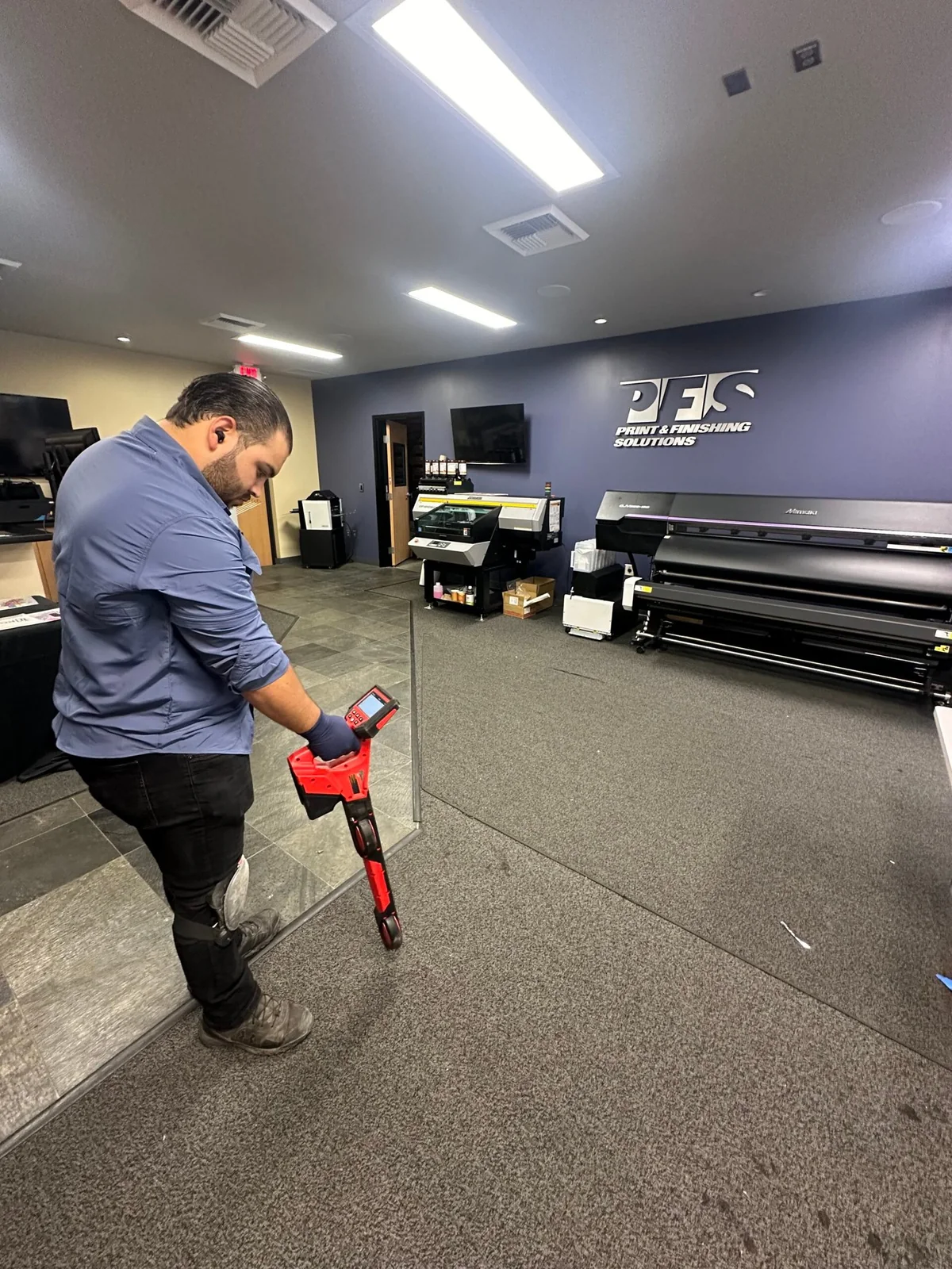 Technician using line locating equipment in a commercial property