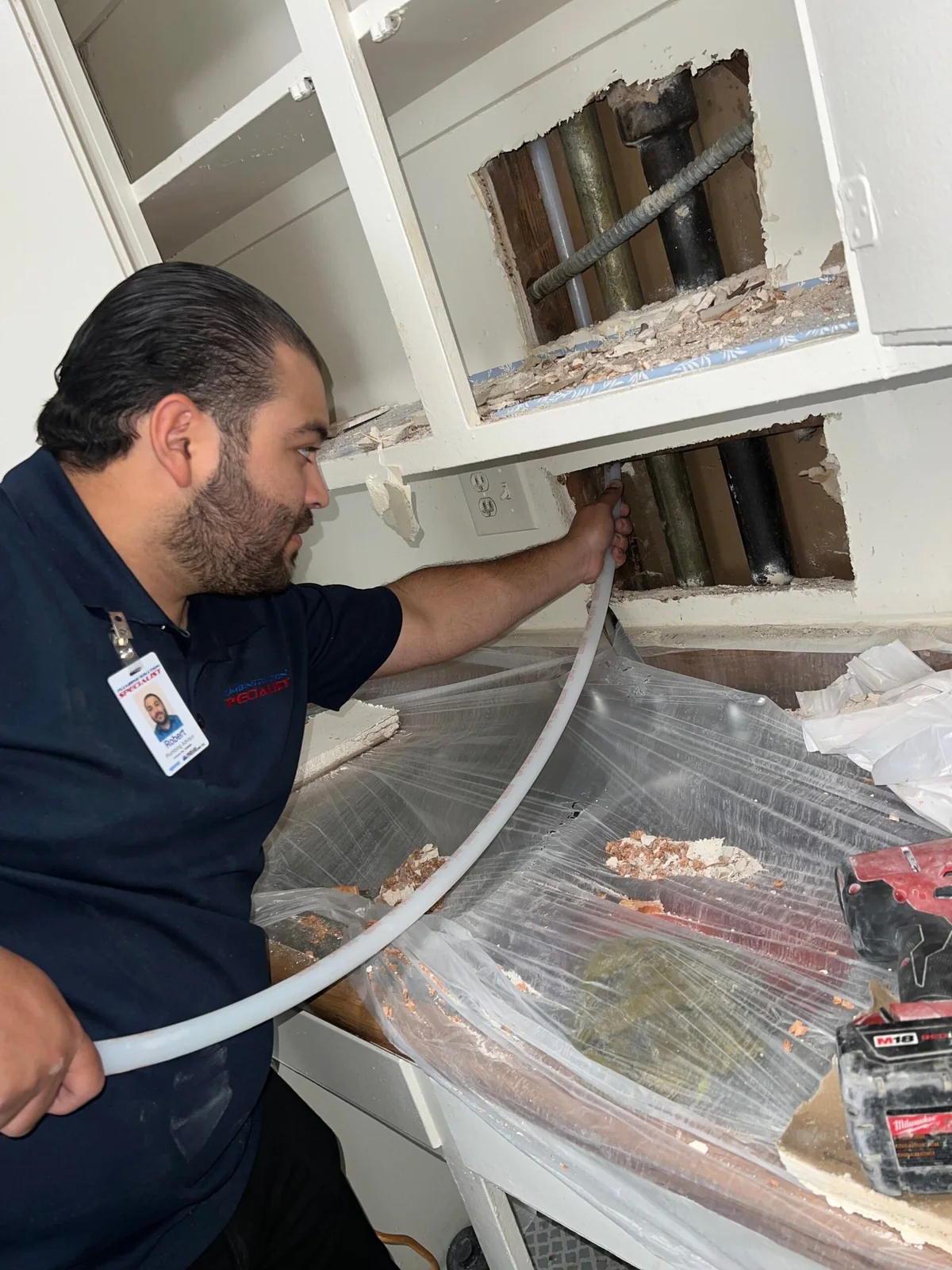 Plumbing Solution Specialist installing new PEX distribution piping