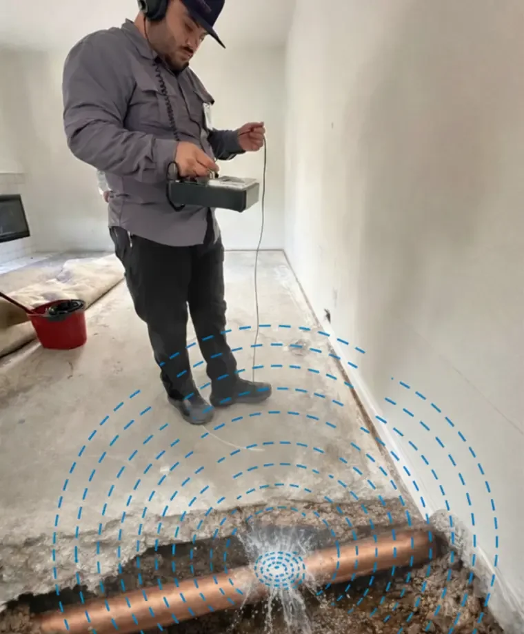 Technician tracing a water line during slab leak detection