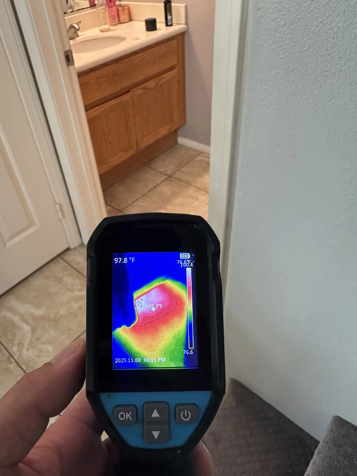 Thermal camera showing a warm floor pattern during leak diagnosis